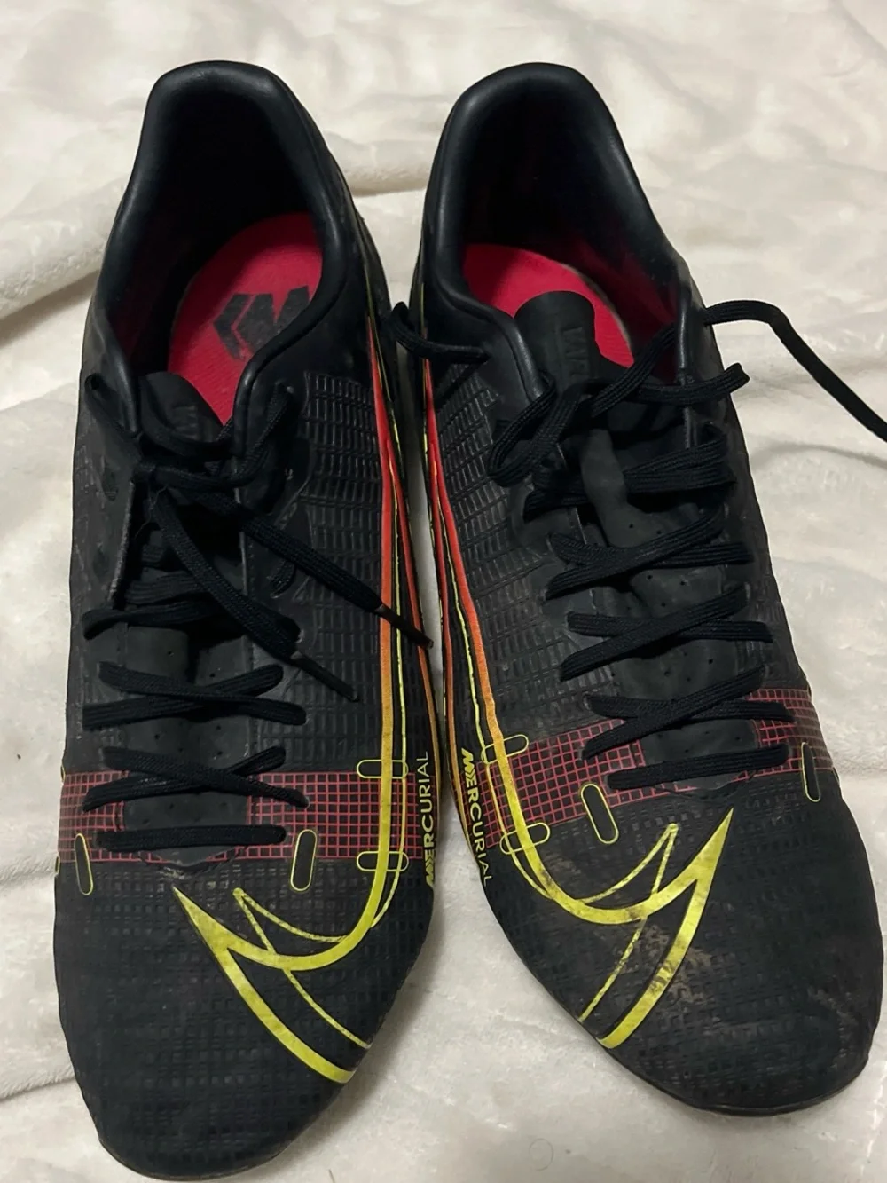 Nike Men's Black Soccer Cleats with Yellow and Red Accents